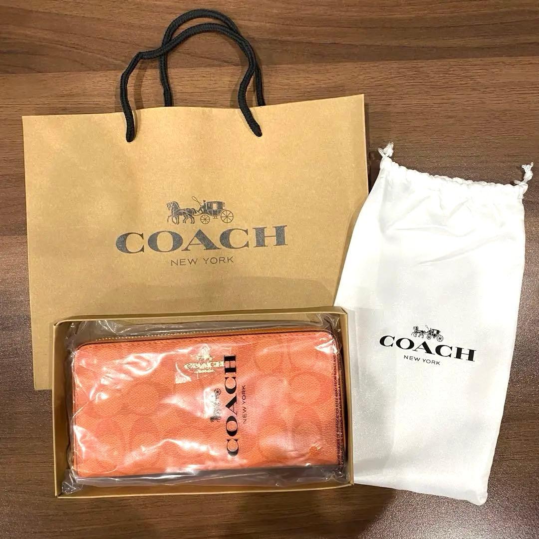 【新品未開封】coach コーチ レディース　長財布　オレンジ　ウォレット　財布 中古・古着通販】COACH (コーチ) 長財布 オレンジ｜ブランド・古着通販